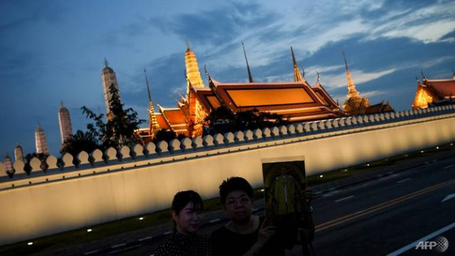a thai woman dressed in black holds a portrait of the late king bhumibol adulyadej outside the grand palace in bangkok thailand 039 s new king maha vajiralongkorn ascended the throne after the death of his father in october 2016 photo afp a thai woman dressed in black holds a portrait of the late king bhumibol adulyadej outside the grand palace in bangkok thailand 039 s new king maha vajiralongkorn ascended the throne after the death of his father in october 2016 photo afp
