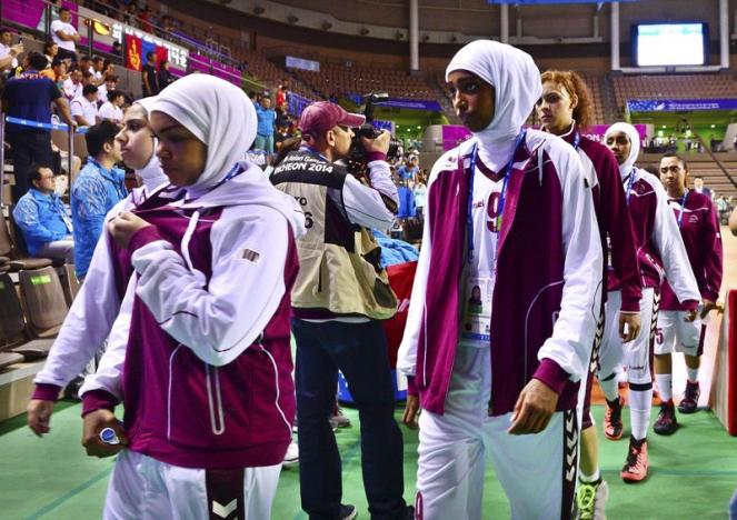 qatar 039 s women 039 s basketball team leaves the court after forfeiting their women 039 s basketball game against mongolia at hwaseong sports complex during the 17th asian games in incheon photo reuters