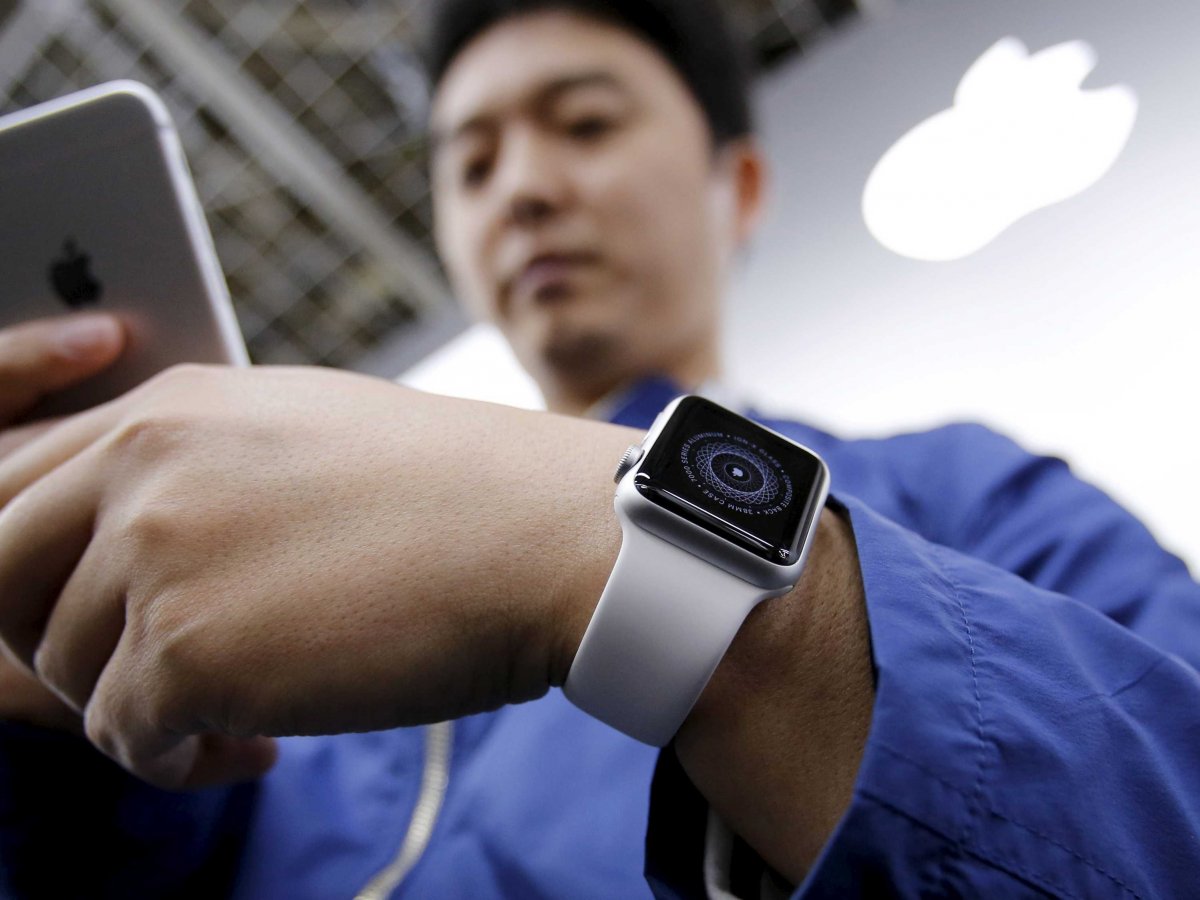 customer tomoyoshi fujimura sets up his apple watch which is to be paired with his iphone after buying it at an electronics store in tokyo april 24 2015 photo reuters