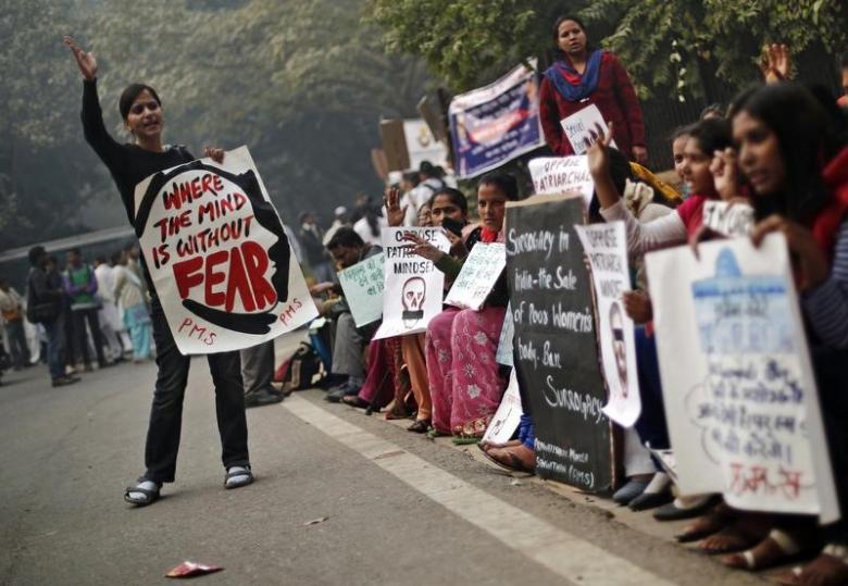 protesters carry placards as they shout slogans during a protest to mark the first anniversary of the delhi gang rape in new delhi photo reuters