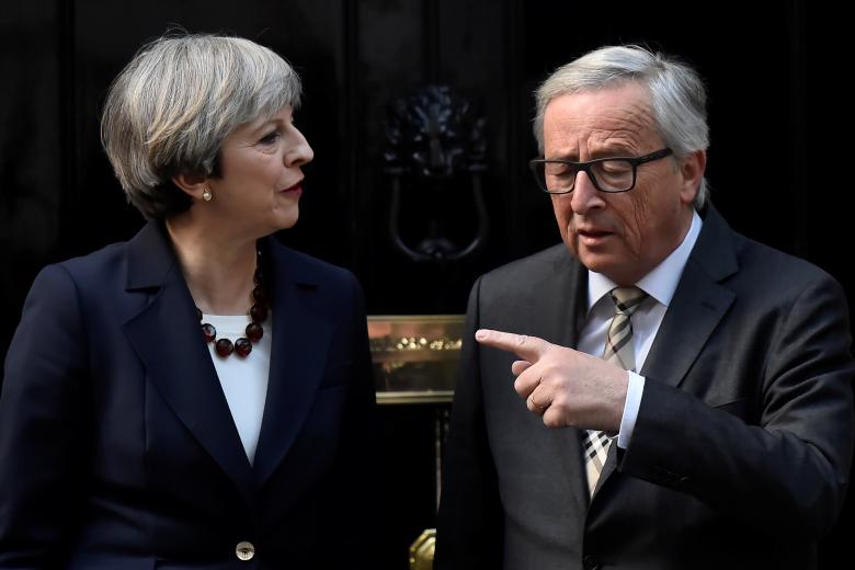 in this file photo britain 039 s prime minister theresa may welcomes head of the european commission president jean claude juncker to downing street in london britain april 26 2017 photo reuters