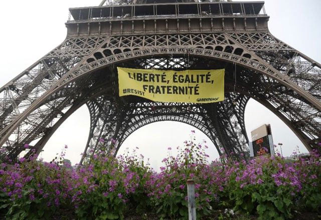 a greenpeace banner at the eiffel tower recalls the values of the french republic quot liberty equality fraternity quot in protest against the far right national front of marine le pen who faces centrist emmanuel macron in sunday 039 s election photo afp a greenpeace banner at the eiffel tower recalls the values of the french republic quot liberty equality fraternity quot in protest against the far right national front of marine le pen who faces centrist emmanuel macron in sunday 039 s election photo afp