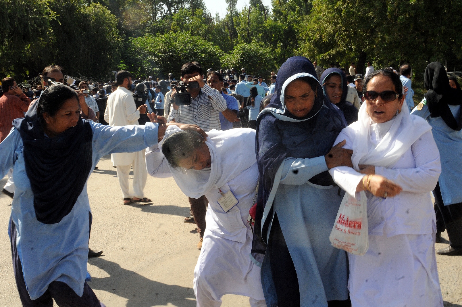 policewomen man handle paramedical staff as they protest in islamabad photo express