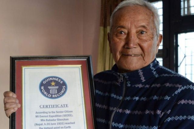 in this photograph taken on february 10 2017 nepalese mountaineer min bahadur sherchan shows off his 2008 guinness world record certificate for being the oldest person to summit mount everest photo afp