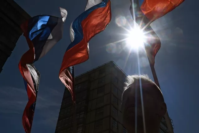 a russian opposition supporter takes part in a rally in central moscow on may 6 2017 to mark five years since the anti putin protest on bolotnaya square that led to dozens of arrests and injuries on both police and protesters sides photo afp a russian opposition supporter takes part in a rally in central moscow on may 6 2017 to mark five years since the anti putin protest on bolotnaya square that led to dozens of arrests and injuries on both police and protesters sides photo afp