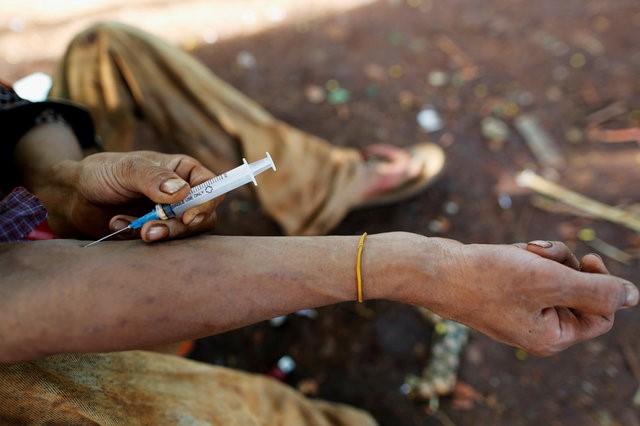 a man injects heroin into his arm photo reuters