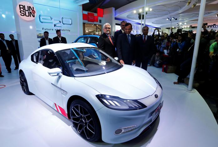 pawan goenka president of mahindra 039 s automotive and farm equipment sectors stands next to mahindra 039 s concept electric sports car 039 halo 039 after its unveiling during the indian auto expo in greater noida photo reuters