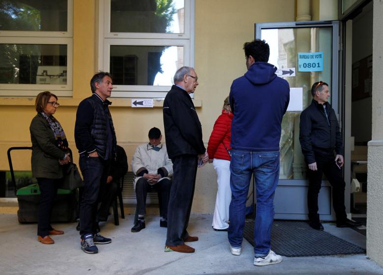 people wait in line before the opening of a polling station for the second round of 2017 french presidential election at a polling station in marseille france may 7 2017 photo reuters
