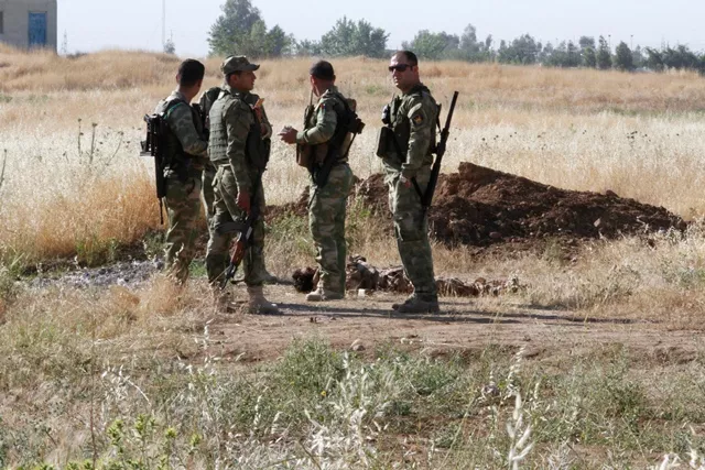 kurdish peshmerga forces stand near the body of a suicide bomber of islamic state in the city of kirkuk iraq may 7 2017 photo reuters kurdish peshmerga forces stand near the body of a suicide bomber of islamic state in the city of kirkuk iraq may 7 2017 photo reuters