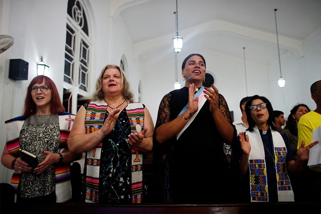 trans baptist reverend allyson robinson from the u s l trans pastors cindy bourgeois from canada 2nd l and alexya salvador from brazil 2nd r and lesbian pastor elaine saralegui sing during a mass in matanzas cuba may 5 2017 photo reuters