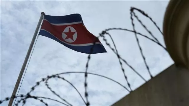 the north korean flag is seen past a barbed wire fenced wall of the north korean embassy in kuala lumpur photo afp the north korean flag is seen past a barbed wire fenced wall of the north korean embassy in kuala lumpur photo afp