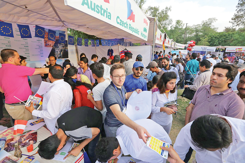 people take part in various activities during the euro village festival being held at lok virsa photos express agencies