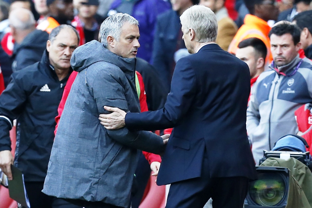 in a first wenger opened his premier league win account against mourinho after 13 attempts with a 2 0 win on sunday photo afp