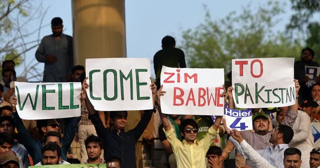 pakistani spectators carry placards as they await the start of the first international t20 cricket match between pakistan and zimbabwe at the gaddafi cricket stadium in lahore on may 22 2015 photo afp pakistani spectators carry placards as they await the start of the first international t20 cricket match between pakistan and zimbabwe at the gaddafi cricket stadium in lahore on may 22 2015 photo afp