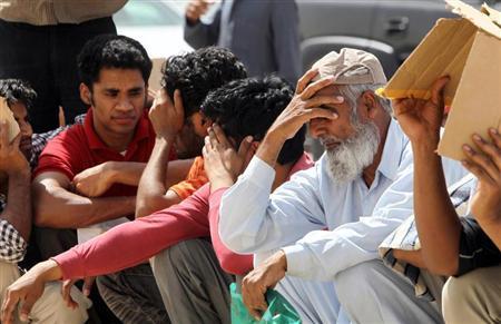 illegal immigrant workers wait in line at the saudi immigration offices at the alisha area west of riyadh photo reuters
