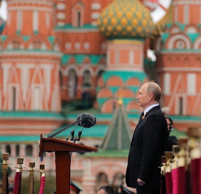 presiding over the massive ceremony to mark russia 039 s victory in world war ii vladimir putin said moscow would quot always be on the side of the forces of peace quot photo afp