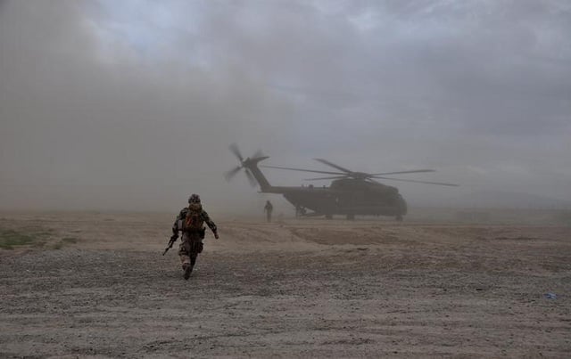 a soldier walks towards a ch 53 helicopter in kunduz afghanistan on march 27 2017 photo reuters