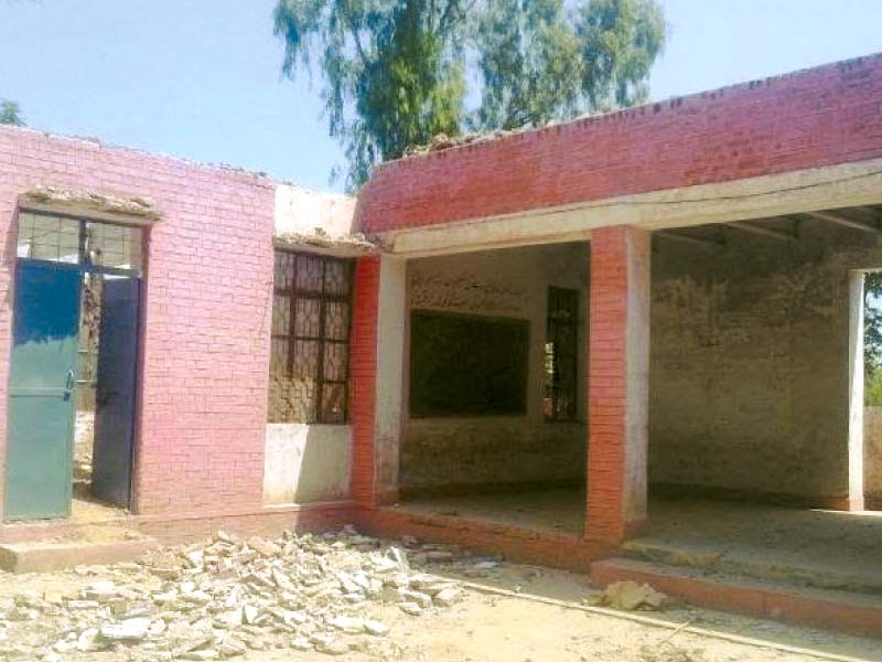 the view of a damaged school building students taking a class under the open sky the plaster of a classroom came down injuring two students photo express