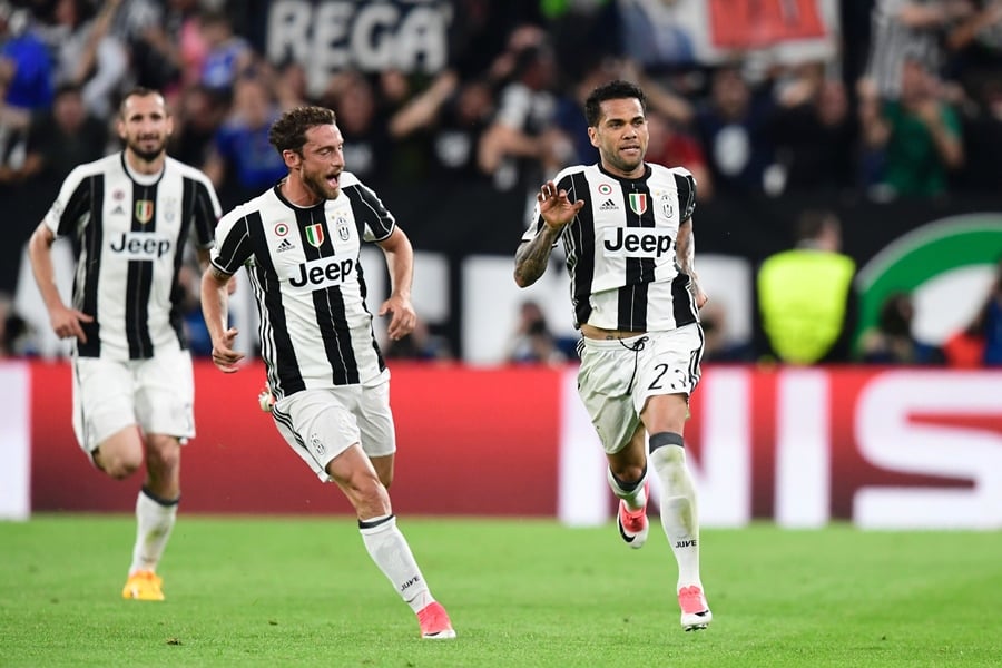 juventus defender from brazil dani alves r celebrates with teammate juventus 039 midfielder from italy claudio marchisio after scoring during the uefa champions league semi final second leg football match juventus vs monaco on may 9 2017 at the juventus stadium in turin photo afp