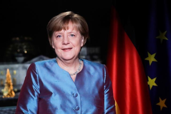 german chancellor angela merkel poses for photographs after the television recording of her annual new year 039 s speech at the chancellery in berlin germany photo reuters