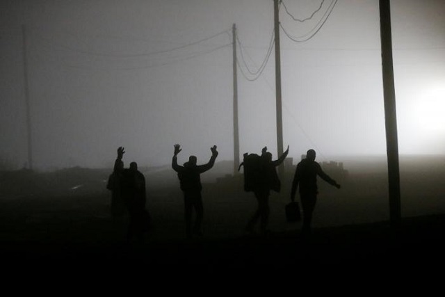 a group of migrants who said they were from djibouti and somalia follow railway tracks towards the canada u s border as seen from emerson manitoba canada photo reuters