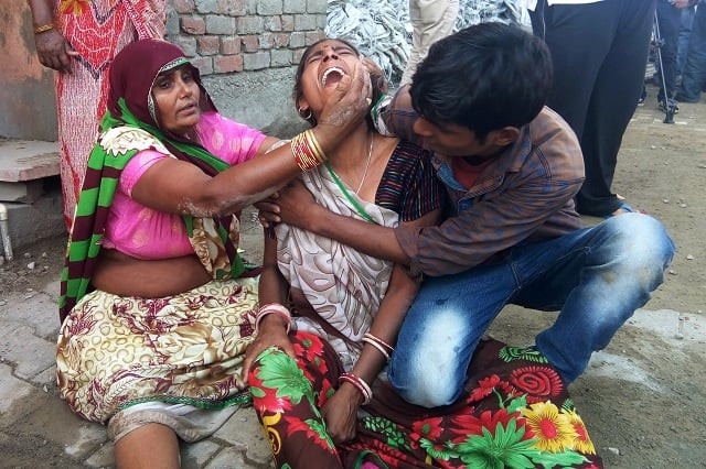 a woman cries after a wall collapsed during a wedding killing at least 24 people in bharatpur in india 039 s rajasthan state on may 11 2017 a wall crashed down on an indian wedding party during a storm killing at least 24 people including four children and injuring many more police said thursday photo afp a woman cries after a wall collapsed during a wedding killing at least 24 people in bharatpur in india 039 s rajasthan state on may 11 2017 a wall crashed down on an indian wedding party during a storm killing at least 24 people including four children and injuring many more police said thursday photo afp