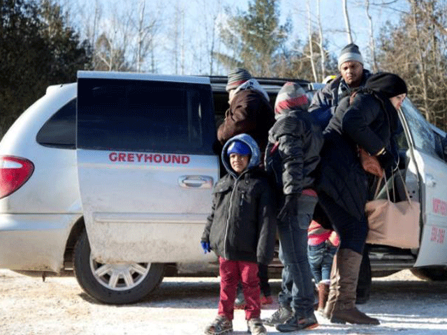 a family which claimed to be from sudan piles out of a northern taxi which drove them to the us canada border in champlain new york us february 17 2017 photo reuters