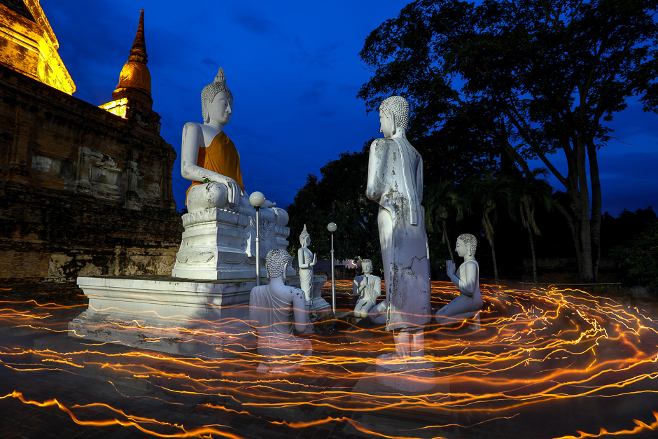 buddhists carry candles as they pray during vesak day an annual celebration of buddha 039 s birth enlightenment and death at wat yai chai mongkhon temple in ayutthaya thailand photo reuters