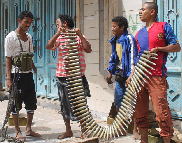 yemeni fighters opposing the huthi rebels hold a bullet belt in the northern entrance of the southern yemeni city of aden as clashes continue to rage in the embattled city between huthi rebels and forces loyal to fugitive yemeni president abedrabbo mansour hadi photo afp