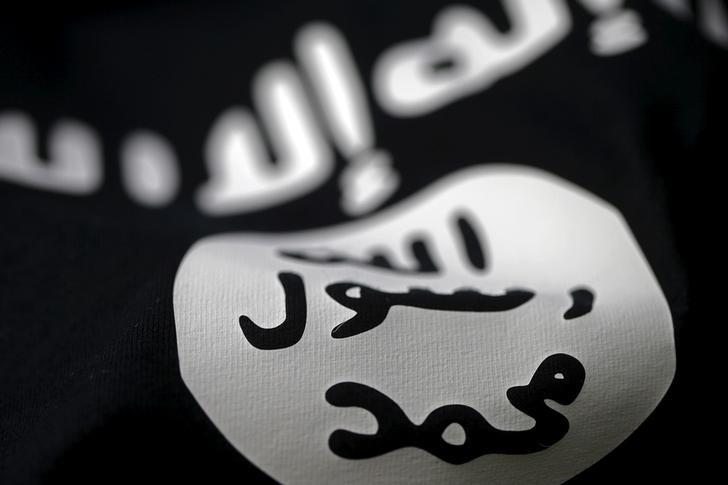 a picture illustration of an islamic state flag photo reuters