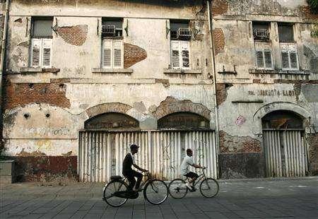 crumbling buildings along the drain need to be demolished to avoid any mishap officials said photo reuters