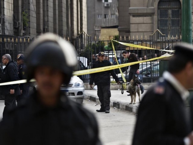 egyptian police investigate the site of an explosion outside the supreme court in cairo on march 2 2015 photo afp