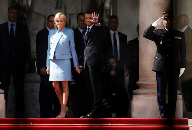french newly elected president emmanuel macron r waves as he poses with his wife brigitte trogneux at the elysee presidential palace after the handover and prior to the inauguration ceremony on may 14 2017 in paris photo afp french newly elected president emmanuel macron r waves as he poses with his wife brigitte trogneux at the elysee presidential palace after the handover and prior to the inauguration ceremony on may 14 2017 in paris photo afp