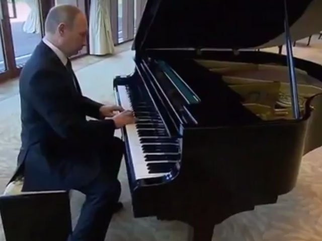 russian president vladimir putin played piano while awaiting chinese leader xi jinping for bilateral talks in beijing on sunday screengrab