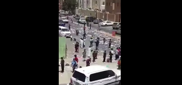 students tearing up their books after final exams screengrab