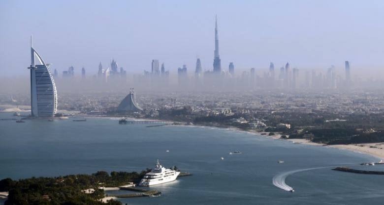 burj khalifa the world 039 s tallest tower and luxury burj al arab hotel l are seen in a general view of dubai uae december 9 2015 picture taken december 9 2015 photo reuters