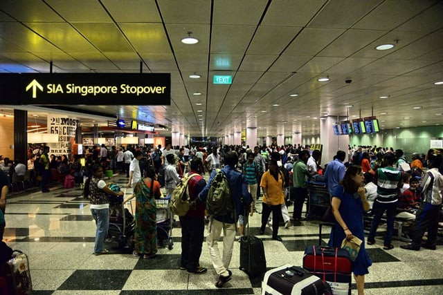 passengers gather at changi international airport terminal 3 after being evacuated from terminal 2 due to a fire in singapore on may 16 2017 photo afp passengers gather at changi international airport terminal 3 after being evacuated from terminal 2 due to a fire in singapore on may 16 2017 photo afp