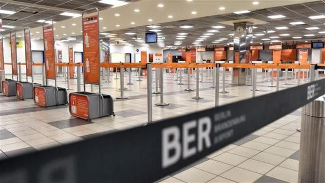 deserted check in desks are seen at the schoenefeld airport during a strike by ground staff in schoenefeld near berlin photo afp deserted check in desks are seen at the schoenefeld airport during a strike by ground staff in schoenefeld near berlin photo afp