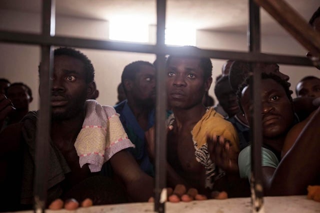 sub saharan illegal migrants and refugees are pictured begging for their release in one surman detention centre surman libya photo reuters