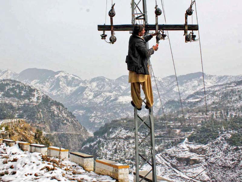 a worker fixes electricity lines damaged by gusty winds and heavy rainfall photo app