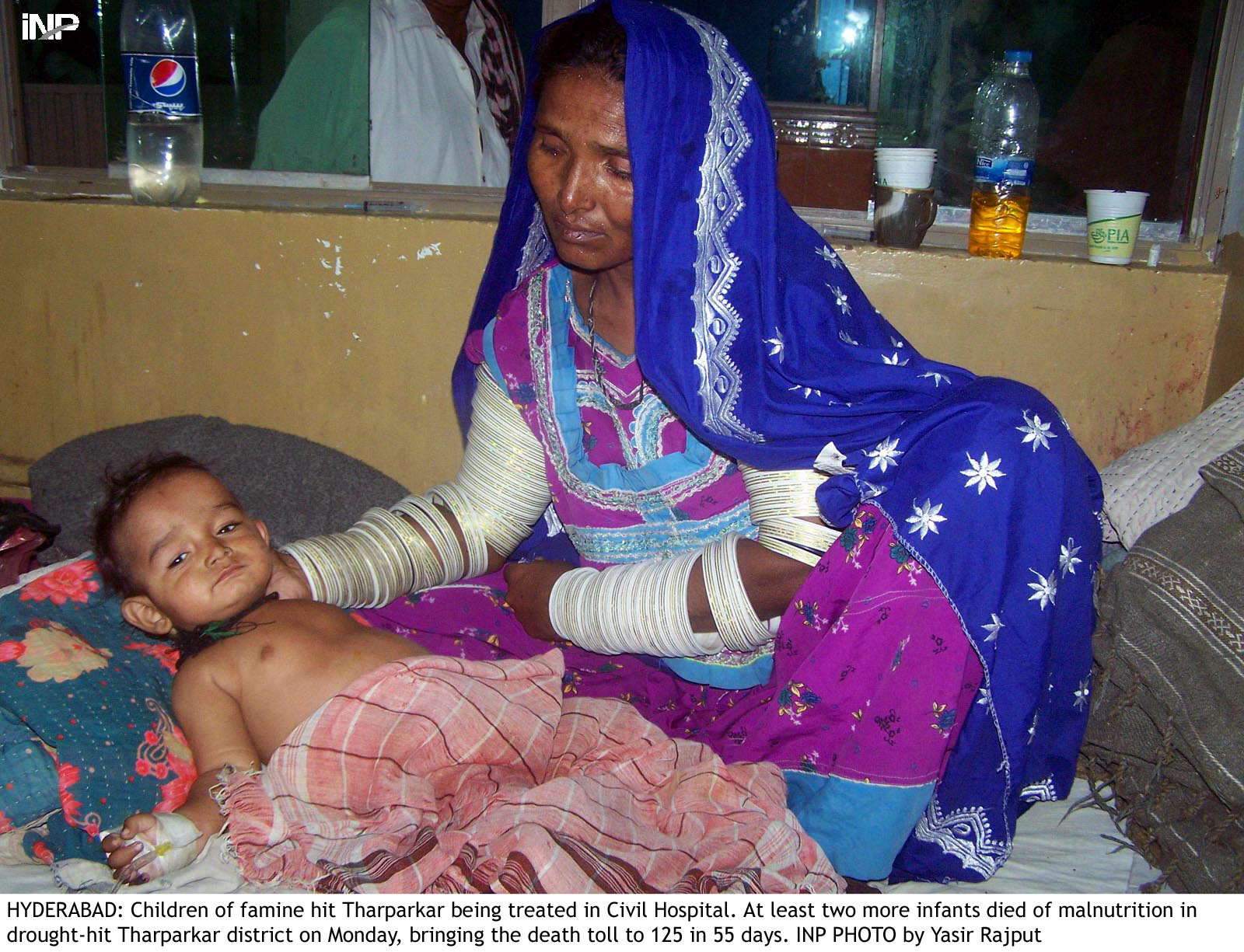 a thari woman tends to her sick child at the civil hospital in hyderabad photo inp