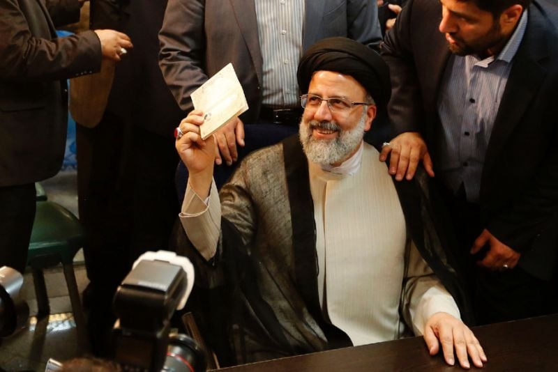 iranian cleric ebrahim raisi gestures after registering his candidacy for the upcoming presidential elections at the ministry of the interior in tehran on april 14 2017 photo afp