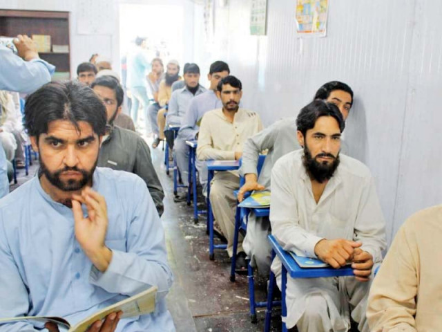 inmates attend a class in peshawar jail photo express inmates attend a class in peshawar jail photo express