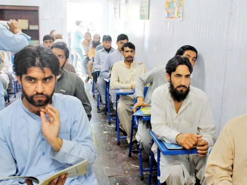 inmates attend a class in peshawar jail photo express inmates attend a class in peshawar jail photo express