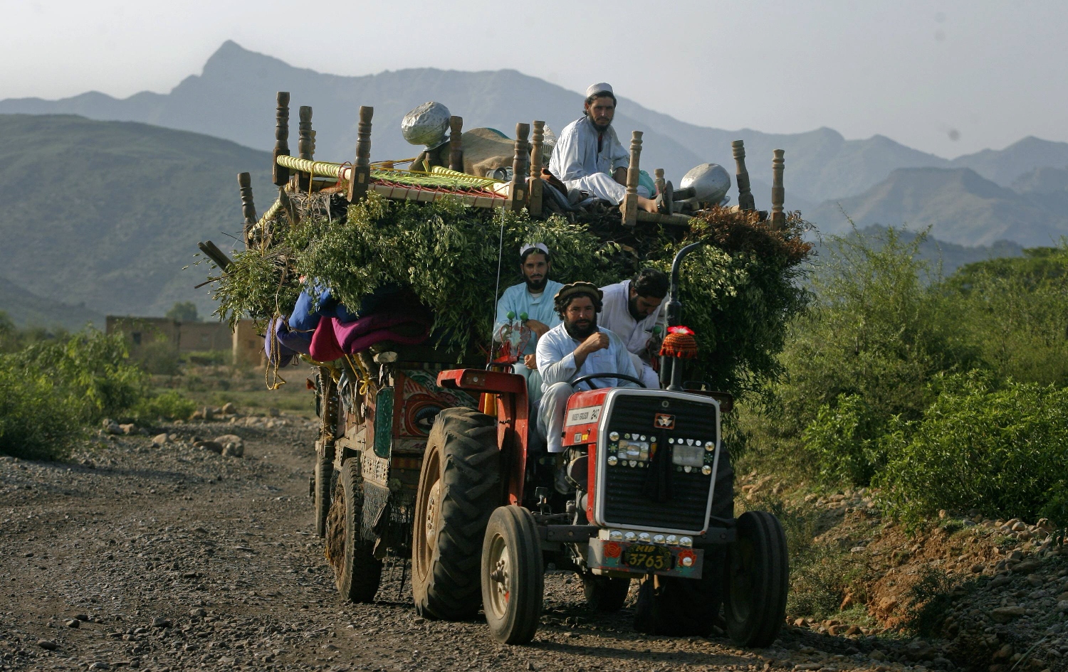 an internally displaced family flee military operations on tractors in tora warai a town in kurram agency located in pakistan 039 s federally administered tribal areas fata during a military trip organised for media along the afghanistan border photo reuters