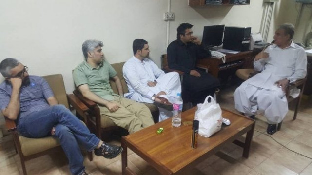 pti leader shah mehmood qureshi meeting with detained social media activists at the fia headquarters on sunday photo twitter pti leader shah mehmood qureshi meeting with detained social media activists at the fia headquarters on sunday photo twitter