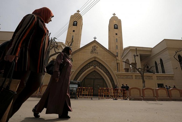women pass by the coptic church that was bombed on sunday in tanta egypt april 10 2017 photo reuters