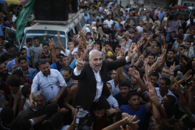 hamas spokesman fawzi barhoum c is carried by palestinians as they celebrate what they said was a victory over israel following a ceasefire in gaza city august 26 2014 photo reuters