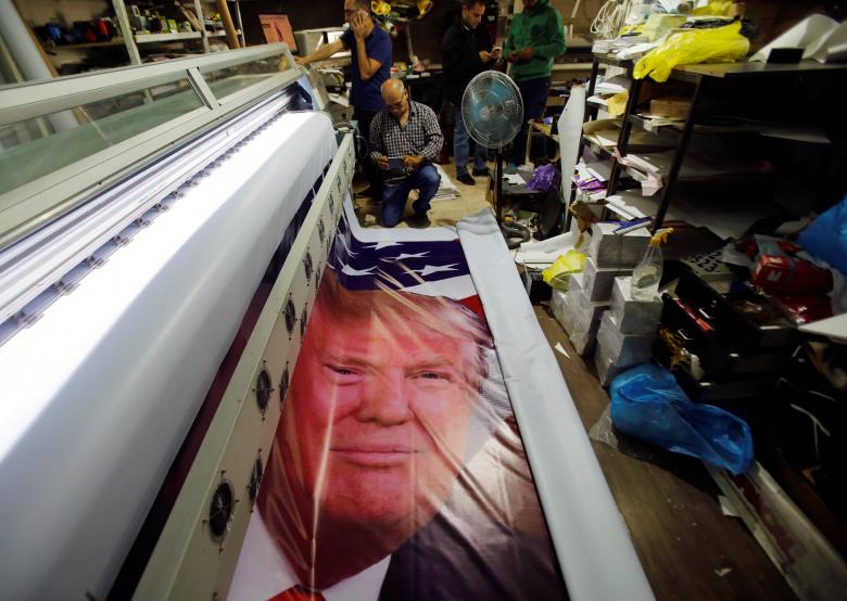 palestinians print posters depicting us president donald trump in preparations for his planned visit in the west bank town of bethlehem may 21 2017 photo reuters