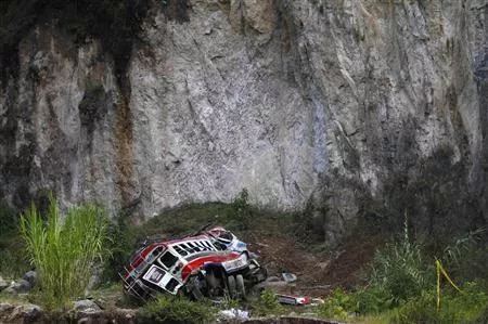 a view shows an autobus at its crash site after going off a cliff photo reuters